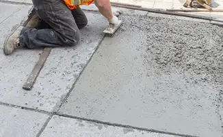 Professional repairing a concrete floor in Marietta, GA
